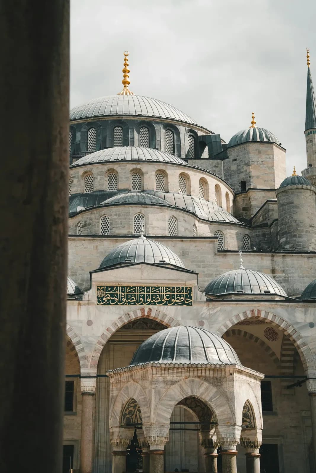 Detailed view of the massive central dome and cascading semi-domes of the Blue Mosque. Witness the engineering marvel of Istanbul.