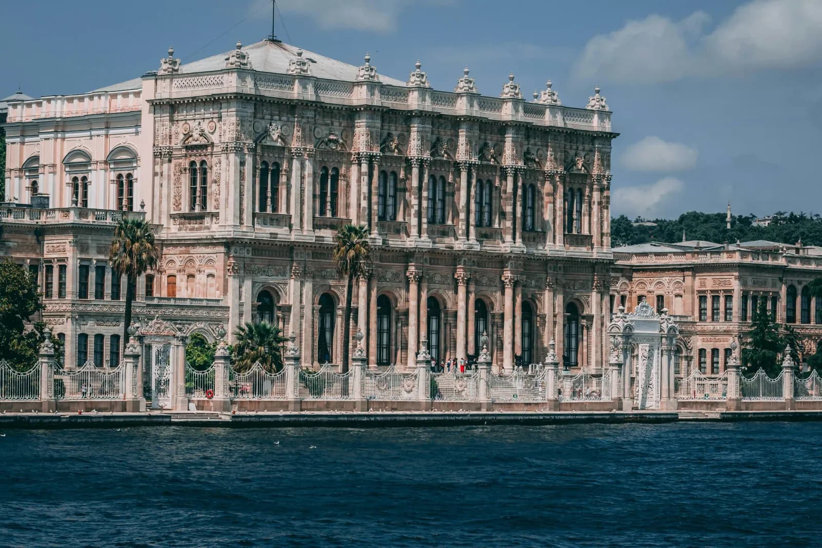 The magnificent facade of Dolmabahce Palace stretching along the Bosphorus. A 19th-century Ottoman masterpiece easily reachable.