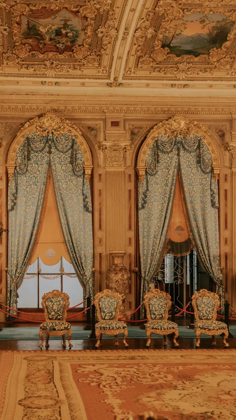 Fine examples of Hereke carpets and antique furniture inside Dolmabahce Palace.