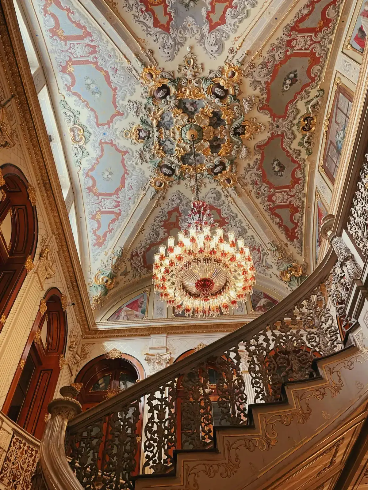 Elegant Baroque-style double staircase inside Dolmabahce Palace. Admire the European architectural influence in Istanbul while.