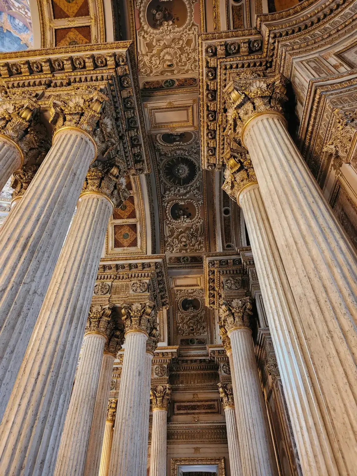 Close-up of the neoclassical architectural details and gold-leaf decorations of Dolmabahce Palace.