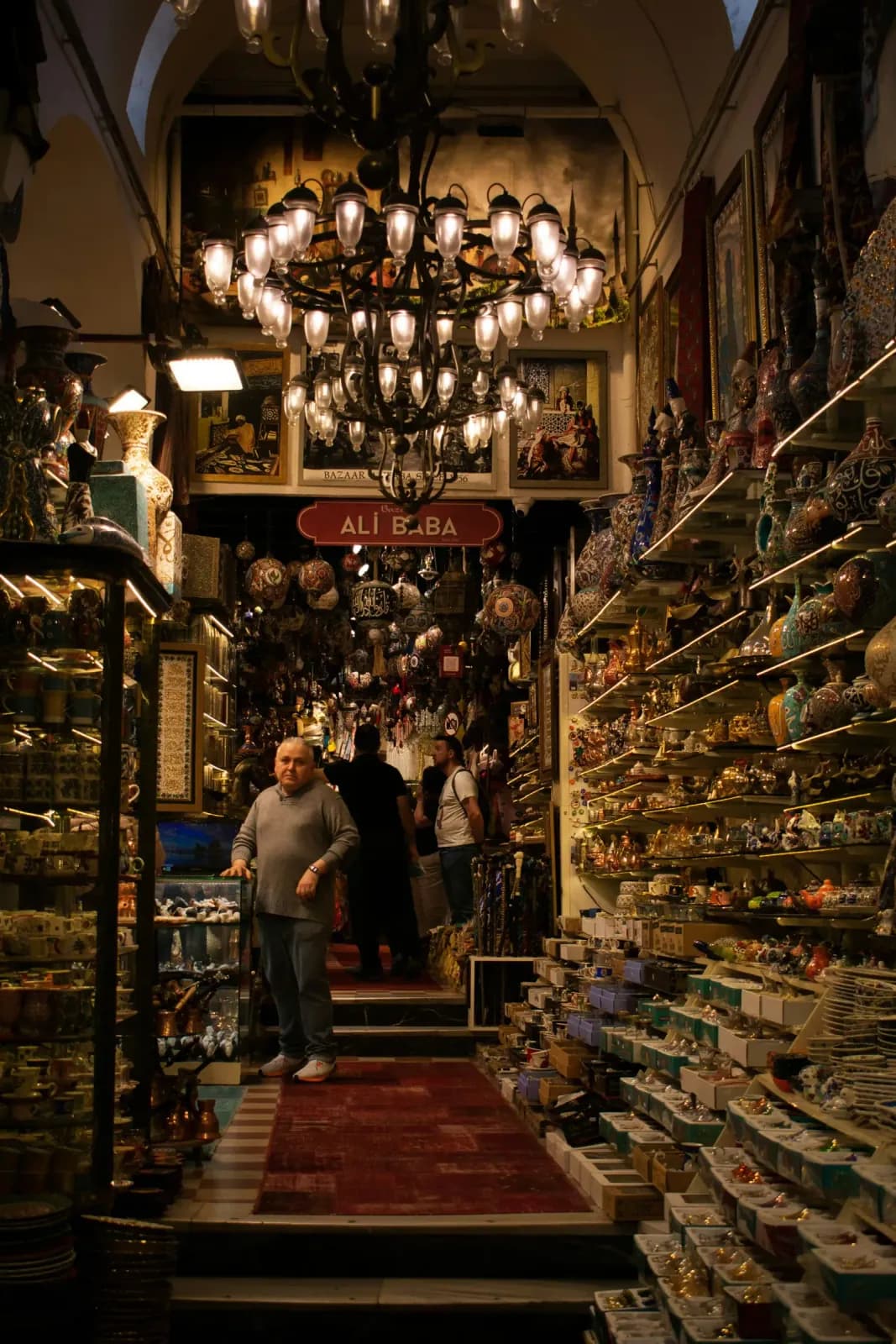 Authentic Turkish carpets and textiles displayed in the historic corridors of the Grand Bazaar.