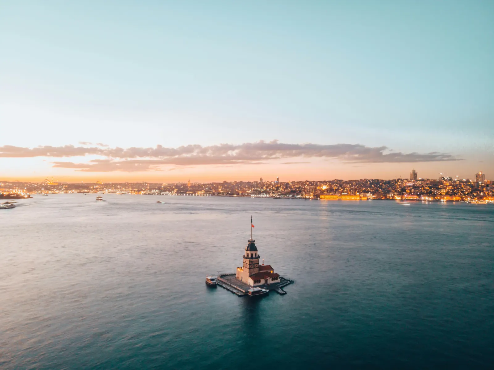Panoramic view of the Maiden's Tower at sunset, reflecting on the Bosphorus waters Experience Istanbul's most romantic landmark....