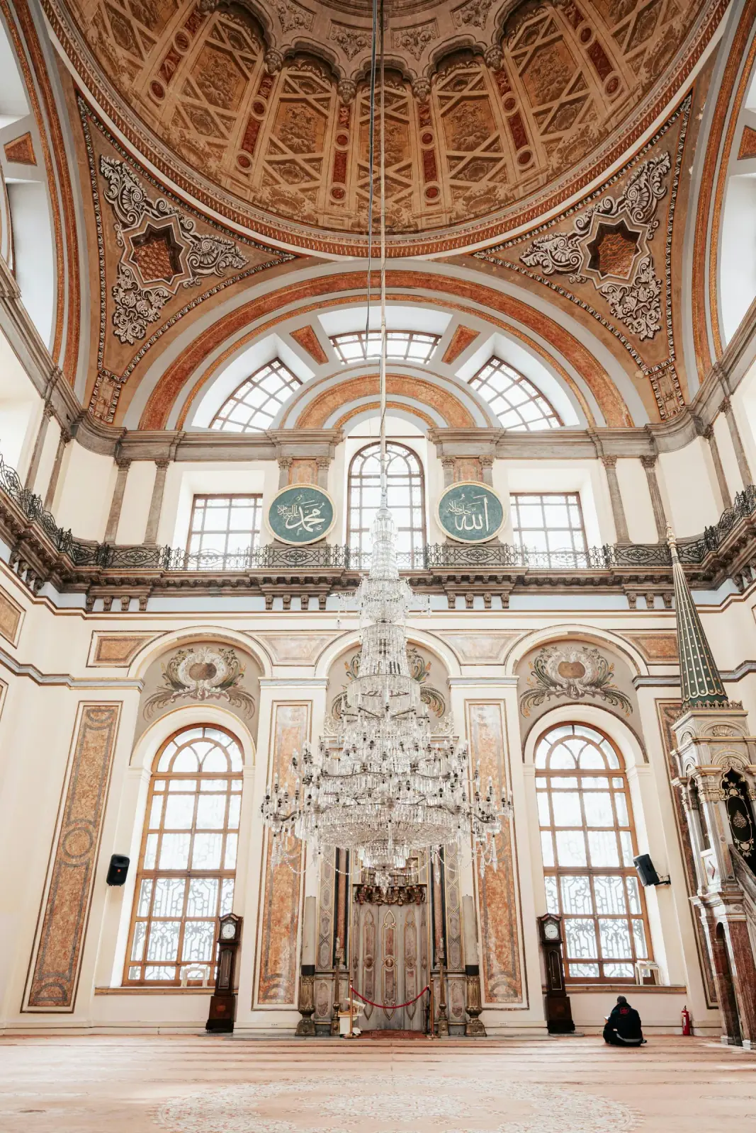 Detailed interior view of the ornate dome and pink mosaics in Ortakoy Mosque.