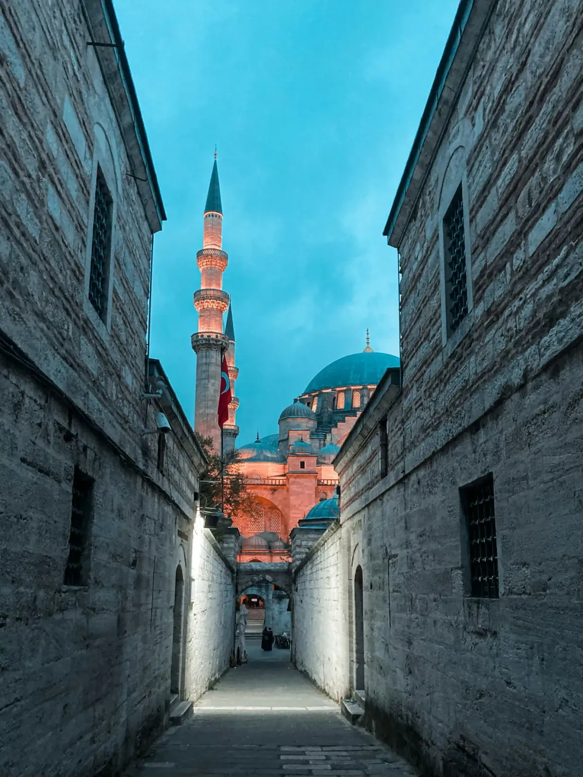The grand inner courtyard of Süleymaniye Mosque, featuring elegant marble columns. A tranquil historic escape near your.