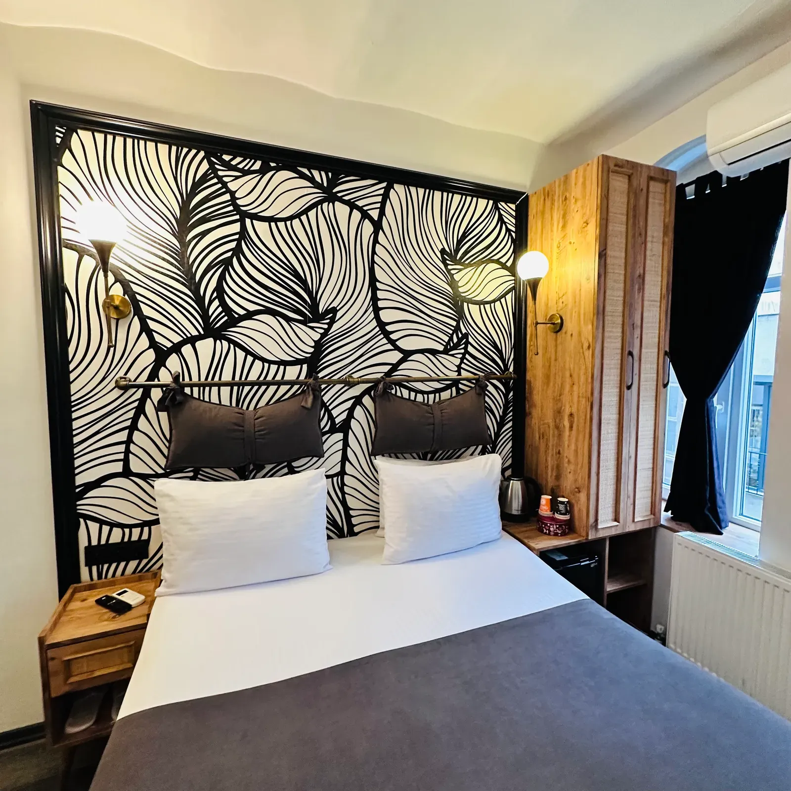 Design Room with double bed, black-and-white botanical wall and wooden wardrobe, Karaköy