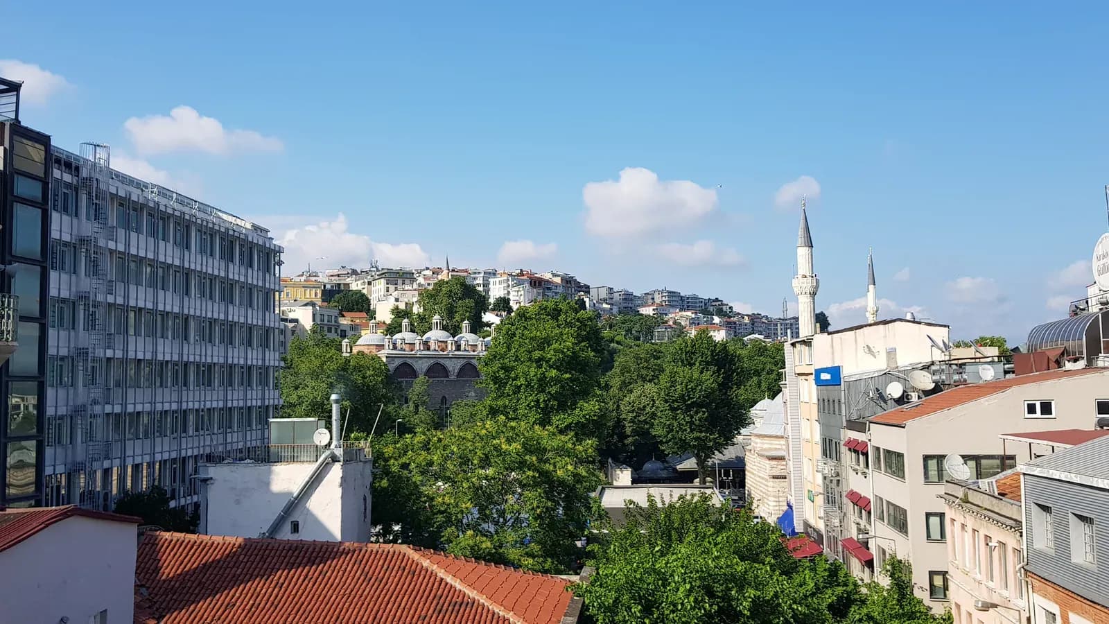 Istanbul skyline with a mosque and stone arches seen from the room's private balcony, Karaköy