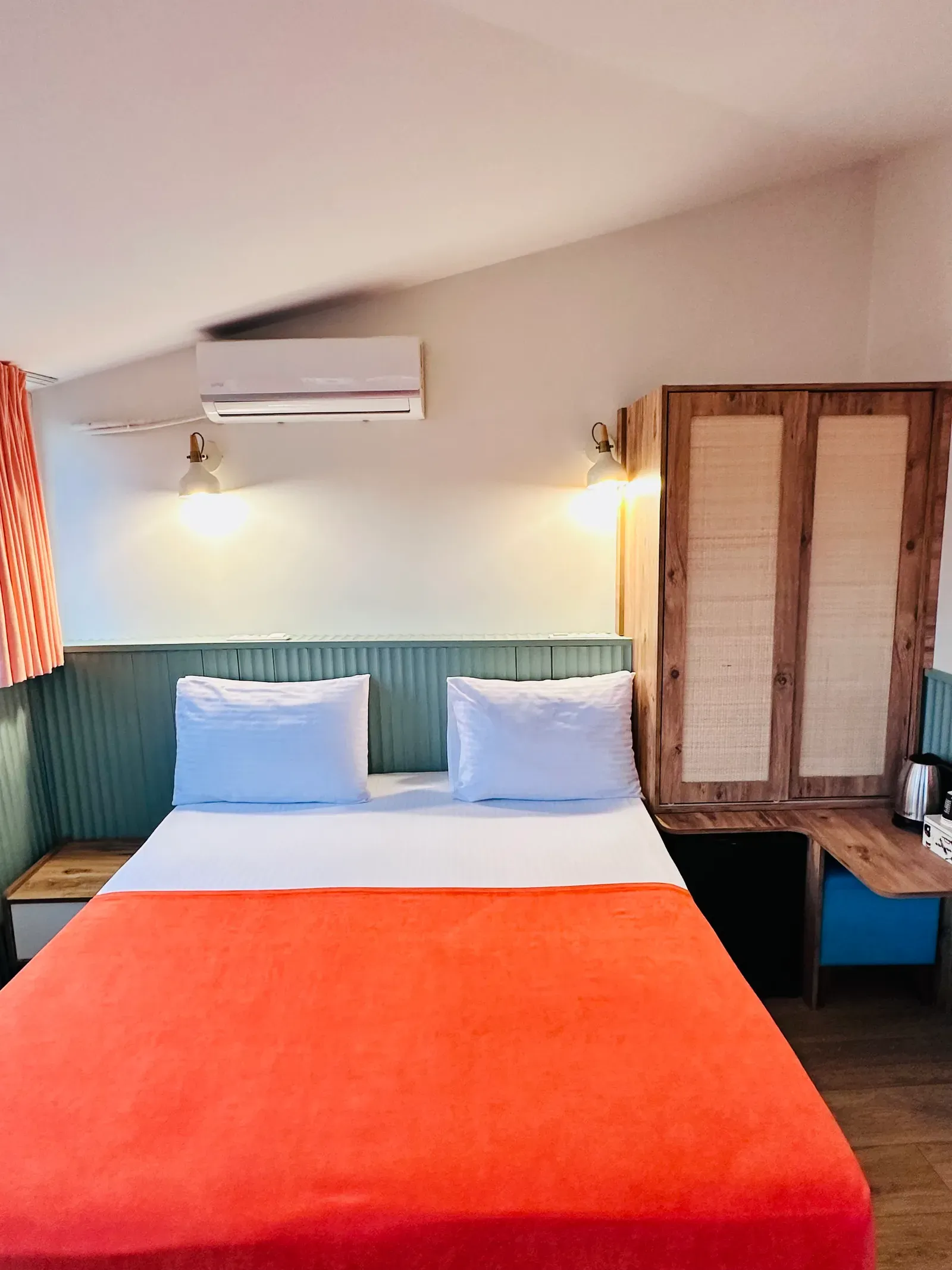 Room with City View — double bed, sage panelling and rattan wardrobe, Karaköy, Istanbul