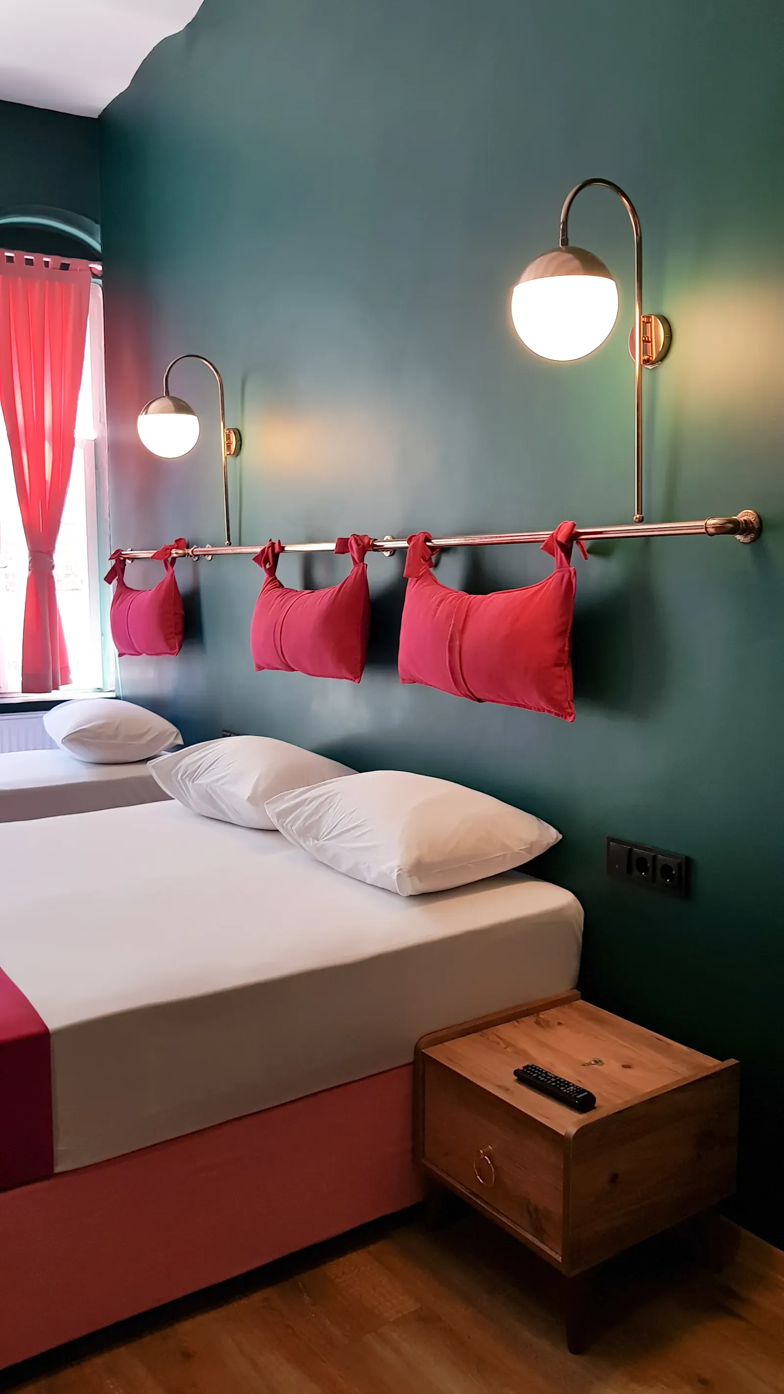 Triple Room with deep green walls and coral curtains, boutique hotel in Karaköy, Istanbul